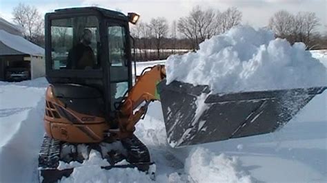 mini x boom snow removal